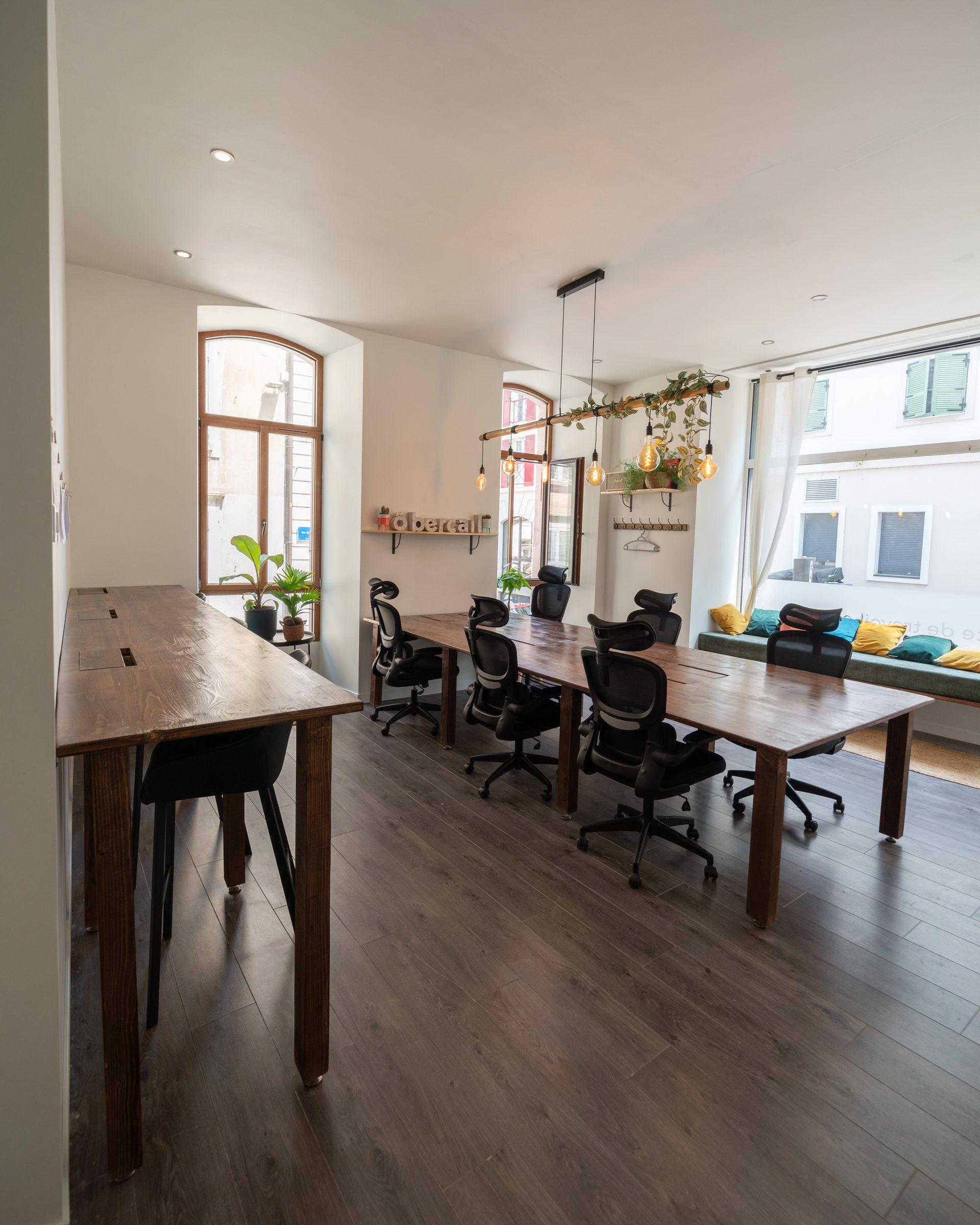 Open-plan coworking space with ergonomic desks at Ô Bercail, Évian-les-Bains